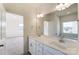 Bright bathroom with dual sinks, quartz counters, modern fixtures, large mirror and soaking tub at Tbd Boomer Ct # 3, Statesville, NC 28677
