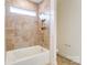 Bathroom with tub and shower featuring ceramic tile surround, and modern fixtures at Tbd Boomer Ct # 3, Statesville, NC 28677