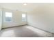 Spacious, carpeted bedroom with two windows providing natural light at Tbd Boomer Ct # 3, Statesville, NC 28677