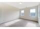 Bright bedroom featuring carpeted floors and two windows providing natural light at Tbd Boomer Ct # 3, Statesville, NC 28677