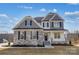 Two-story home with stone and siding exterior, well-manicured lawn, and inviting entryway at Tbd Boomer Ct # 3, Statesville, NC 28677