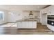 Modern kitchen with white cabinets, stainless steel appliances, large island, and ample counter space at Tbd Boomer Ct # 3, Statesville, NC 28677