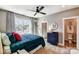 Bright bedroom with large window, stylish blue accents, and modern furnishings at Tbd Boomer Ct # 5, Statesville, NC 28677