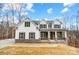 New construction home showcasing traditional architectural style, complete with stone accents and a welcoming front porch at Tbd Boomer Ct # 5, Statesville, NC 28677