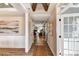 Inviting hallway with hardwood floors, beam ceiling, and view into living room at Tbd Boomer Ct # 5, Statesville, NC 28677