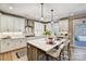 Spacious kitchen with white cabinets, stainless steel appliances, and a large center island at Tbd Boomer Ct # 5, Statesville, NC 28677