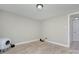 Minimalist bedroom featuring light grey walls, wood-look floors and plenty of room at 103 Moore Ave, Mount Holly, NC 28120