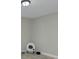 Minimalist bedroom with light grey walls, wood-look floors, and modern pet furniture at 103 Moore Ave, Mount Holly, NC 28120