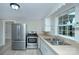 Bright kitchen with stainless steel appliances, sleek countertops, and neutral color scheme at 103 Moore Ave, Mount Holly, NC 28120