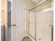 Bathroom featuring a shower with glass doors, neutral walls, and tile flooring at 11544 Costigan Ln # 8306, Charlotte, NC 28277