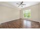 Empty bedroom featuring hardwood floors and natural light at 11544 Costigan Ln # 8306, Charlotte, NC 28277