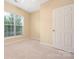 Bedroom with a large window and neutral walls at 11544 Costigan Ln # 8306, Charlotte, NC 28277