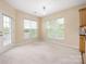 Dining area with natural light, neutral walls, access to the balcony and tile countertops at 11544 Costigan Ln # 8306, Charlotte, NC 28277