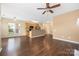 Open living space featuring a kitchen island, hardwood floors, and neutral paint at 11544 Costigan Ln # 8306, Charlotte, NC 28277