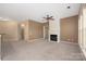 Living room features neutral walls, a fireplace, ceiling fan, and natural light streaming through the windows at 11544 Costigan Ln # 8306, Charlotte, NC 28277