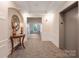 Well-lit building lobby featuring an elevator, neutral colors, and a decorative table at 11544 Costigan Ln # 8306, Charlotte, NC 28277