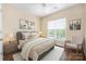 Inviting primary bedroom with a ceiling fan, neutral tones, and large window at 11544 Costigan Ln # 8306, Charlotte, NC 28277