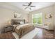 Comfortable primary bedroom featuring a large window and neutral decor at 11544 Costigan Ln # 8306, Charlotte, NC 28277