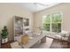 Home office space with built-in shelving and a large window with natural light at 11544 Costigan Ln # 8306, Charlotte, NC 28277