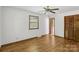 Bedroom featuring wood-look floors, natural light from the window, and a closet at 119 Legacy Ln, Harmony, NC 28634