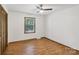 Bedroom featuring wood-look floors, neutral paint, and a ceiling fan at 119 Legacy Ln, Harmony, NC 28634