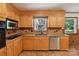 Well-lit kitchen featuring wood cabinets, stainless steel appliances, and tiled backsplash at 119 Legacy Ln, Harmony, NC 28634