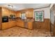 Classic kitchen with wood cabinets, stainless steel appliances, and tile backsplash at 119 Legacy Ln, Harmony, NC 28634