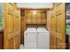 Convenient laundry area with side-by-side washer and dryer inside a closet at 119 Legacy Ln, Harmony, NC 28634