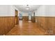 View of the living room, featuring wood floors and wood paneling at 119 Legacy Ln, Harmony, NC 28634