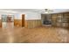 Spacious living room featuring a cozy fireplace, wood floors, and natural light at 119 Legacy Ln, Harmony, NC 28634