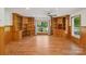 Bright living room featuring built-in shelving, desk, and large windows offering scenic outdoor views at 119 Legacy Ln, Harmony, NC 28634