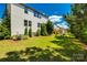 Well-maintained backyard with trees and landscaped with a view of the house at 1226 Clingman Dr, Fort Mill, SC 29715
