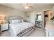 Well-lit bedroom featuring a bed, shelving unit, and a mirror at 1226 Clingman Dr, Fort Mill, SC 29715