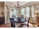 Bright dining area with hardwood floors, chandelier, and natural light from large windows at 1226 Clingman Dr, Fort Mill, SC 29715