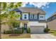 Charming two-story home with a well-maintained lawn and a two-car garage at 1226 Clingman Dr, Fort Mill, SC 29715