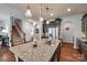 Kitchen island with a stainless steel sink and granite countertops at 1226 Clingman Dr, Fort Mill, SC 29715