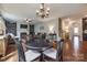 Open living room with hardwood floors, fireplace, and chandelier lighting at 1226 Clingman Dr, Fort Mill, SC 29715