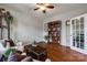 Cozy living room showcasing a bookshelf and hardwood floors at 1226 Clingman Dr, Fort Mill, SC 29715