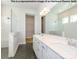Elegant bathroom with double vanity, white cabinets, modern fixtures, and a walk-in shower with glass enclosure at 1338 Idyllic Ln, Waxhaw, NC 28173