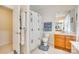 Bathroom with a shower and commode area featuring a tile floor and bath accessories at 14818 Hawick Manor Ln, Pineville, NC 28134