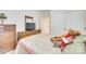 Comfortable bedroom showcasing a plush bed, dresser, and closet space at 14818 Hawick Manor Ln, Pineville, NC 28134