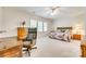 Spacious bedroom featuring a ceiling fan, natural light, and a cozy sitting area, perfect for relaxation at 14818 Hawick Manor Ln, Pineville, NC 28134
