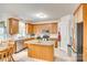 Functional kitchen featuring an island, stainless appliances, and ample cabinet space at 14818 Hawick Manor Ln, Pineville, NC 28134