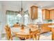 Bright kitchen nook with a dining table and stainless steel appliances and view into the kitchen at 14818 Hawick Manor Ln, Pineville, NC 28134
