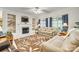 Bright living room with fireplace, built-in shelves, plush seating, and large windows at 14818 Hawick Manor Ln, Pineville, NC 28134