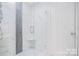 This bathroom boasts an elegant glass-enclosed shower, complete with modern fixtures and finishes at 1745 Matheson Ave, Charlotte, NC 28205