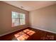Bright bedroom with hardwood floors and a large window offering natural light at 1745 Matheson Ave, Charlotte, NC 28205