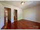 Well-lit bedroom with neutral walls has views to other rooms and the ensuite bathroom at 1745 Matheson Ave, Charlotte, NC 28205
