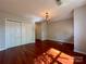Ample bedroom with hardwood floors, modern lighting, and closet space at 1745 Matheson Ave, Charlotte, NC 28205