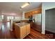 Open concept kitchen with island, stainless steel appliances and hardwood floors at 1745 Matheson Ave, Charlotte, NC 28205
